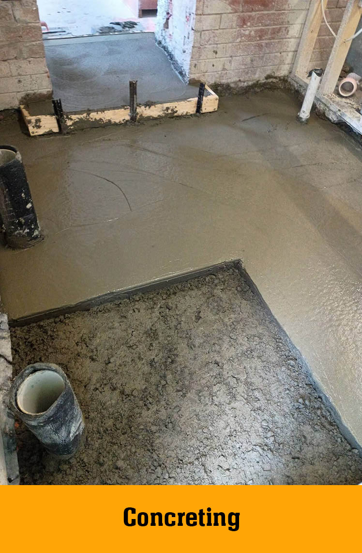 Freshly poured concrete floor inside a renovation, labelled Concreting