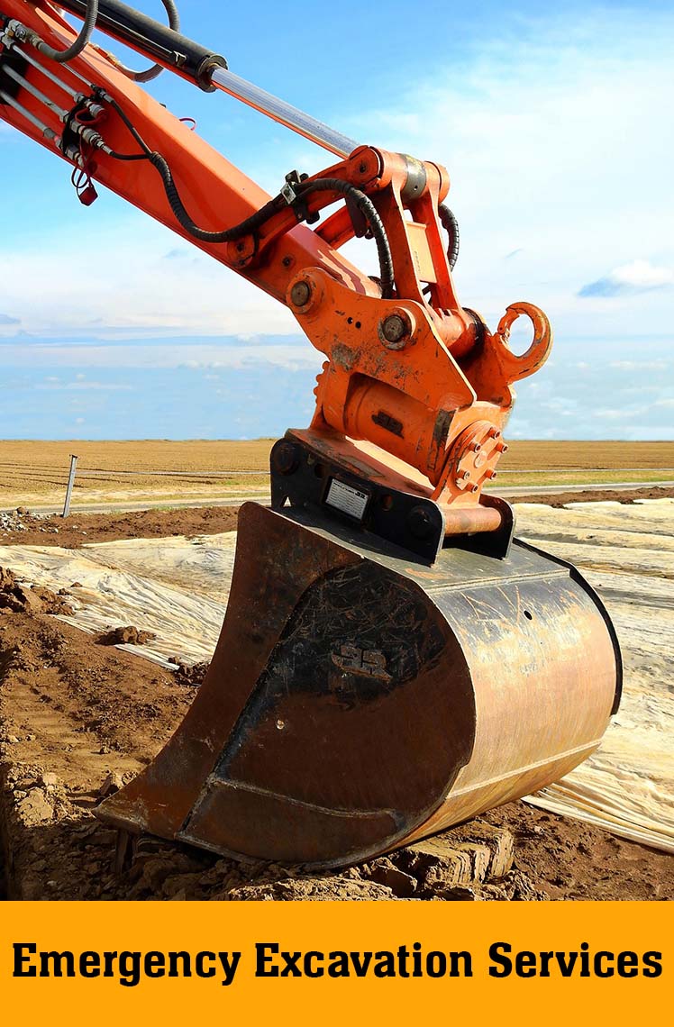 Close-up of an excavator bucket on a cleared site, labelled Emergency Excavation Services