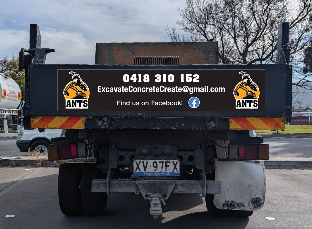 Back of a tipper truck with a sign: ANTS, 0418 310 152, ExcavateConcreteCreate@gmail.com, Find us on Facebook