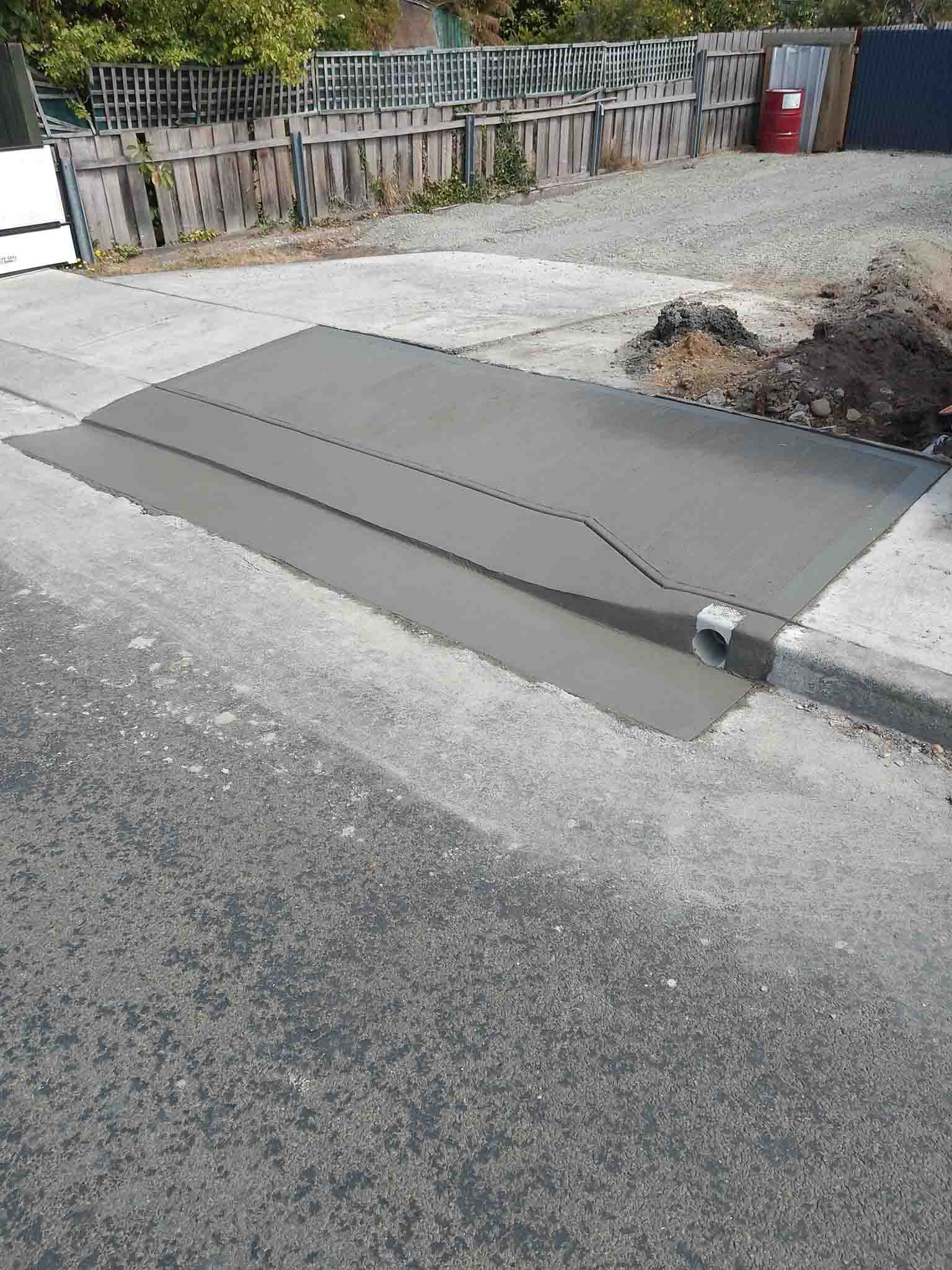 New concrete driveway crossover at a street kerb