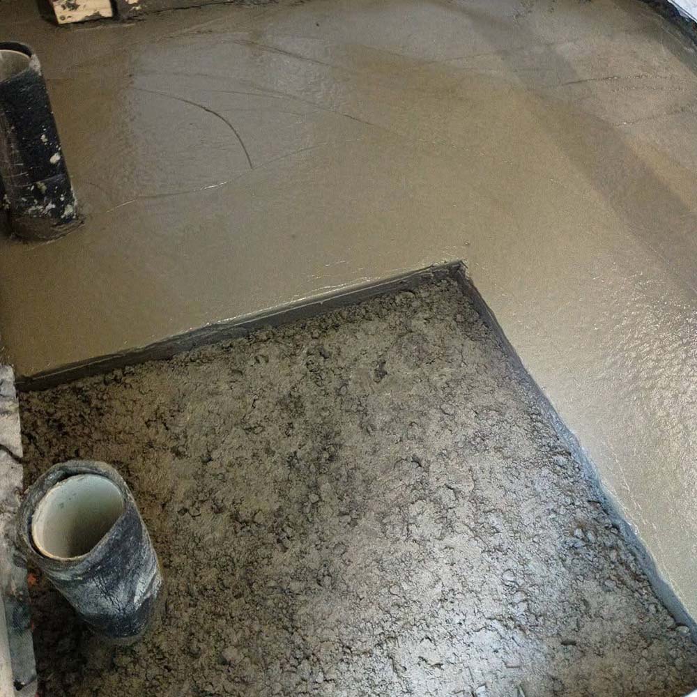 Freshly poured concrete floor inside a renovation