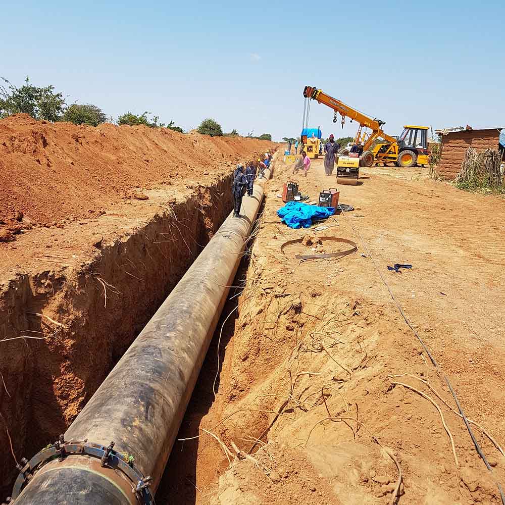 Large pipe laid in a long open trench